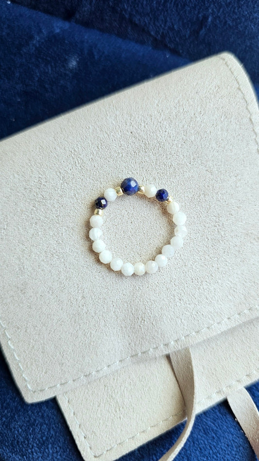 Close-up of Cosmic Trinity elastic ring with 3mm Lapis Lazuli, Black Tourmaline, and Moonstone natural beads.