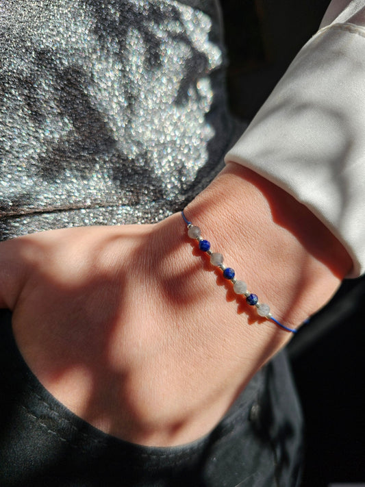 Handmade Labradorite and Lapis Lazuli bracelet with sterling silver beads on adjustable cord, combining elegance with positive energy and protection.