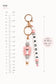 Pastel silicone bag charm with pink bear, beads and rose gold details
