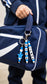 Personalized name bag charm shown on a school backpack, sports bag and house keys, helping children easily identify their belongings and avoid mix-ups.