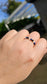 Close-up of Cosmic Trinity elastic ring with 3mm Lapis Lazuli, Black Tourmaline, and Moonstone natural beads.