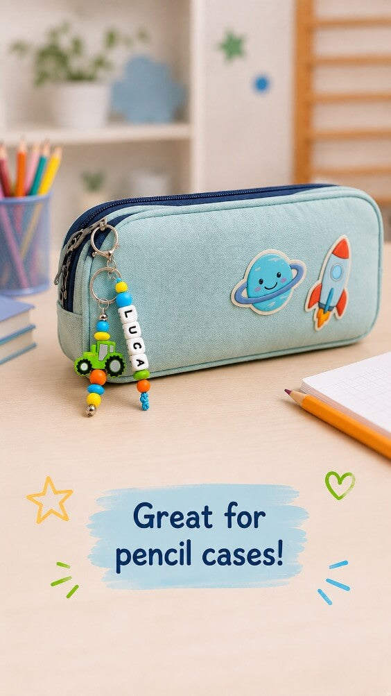 Personalised silicone bead name tag with colourful tractor design for a child's school bag
