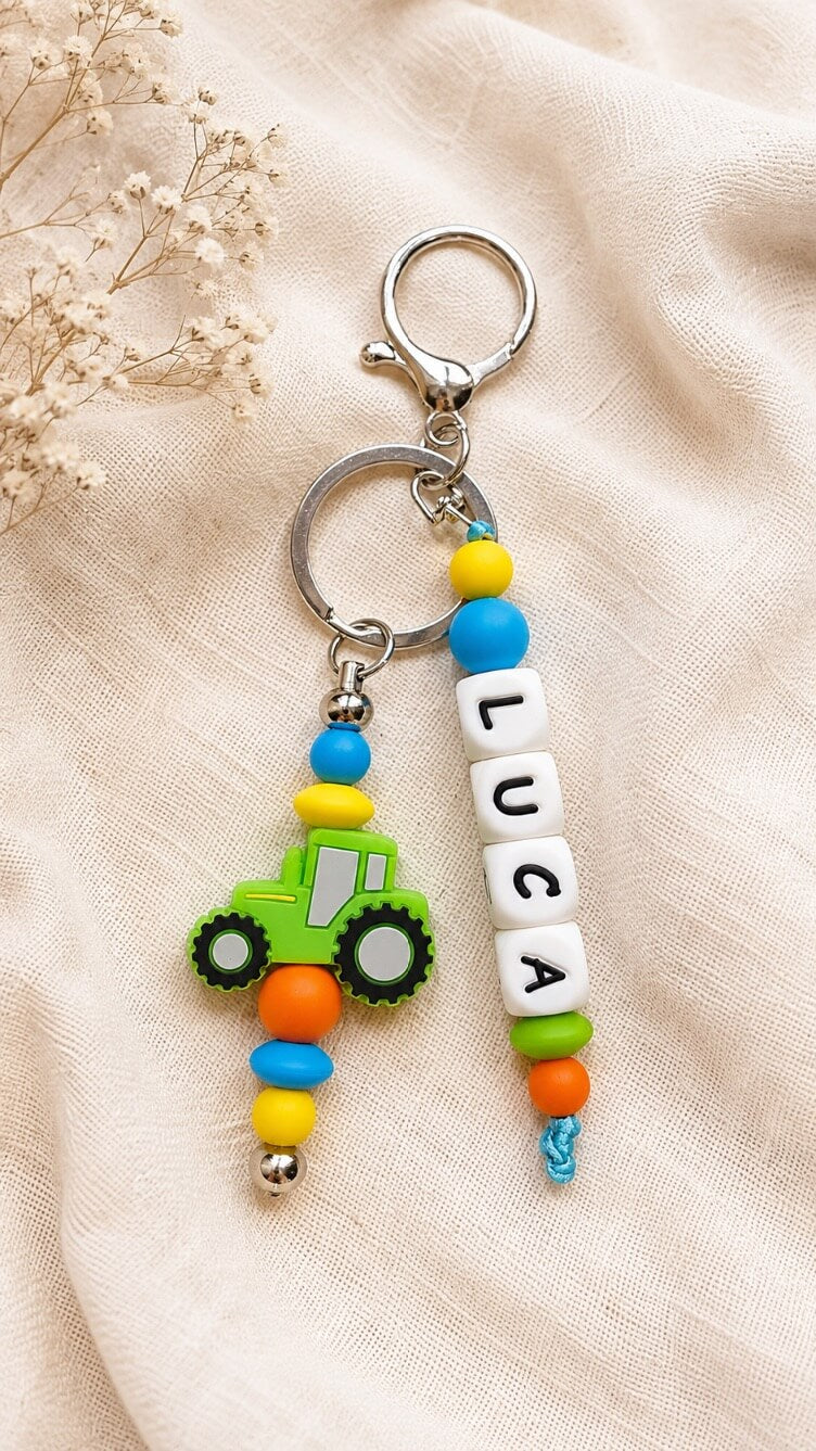 Personalised tractor name charm attached to a child's school backpack for easy identification
