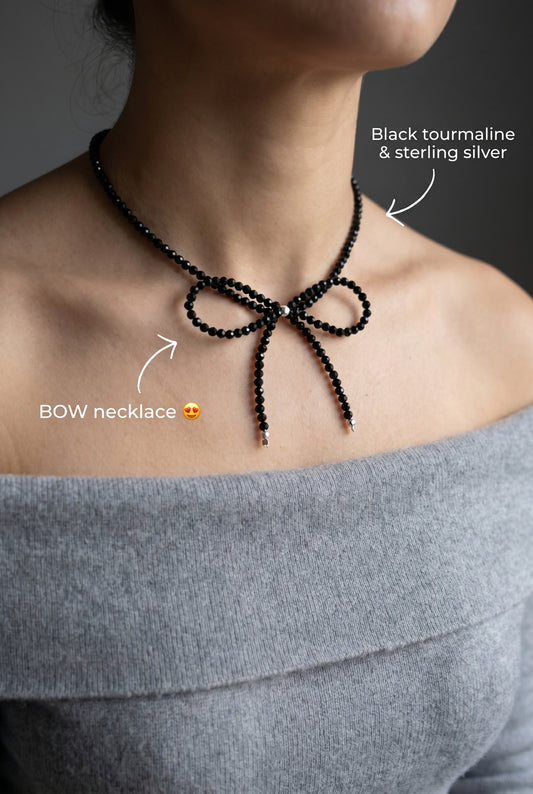 Handmade black tourmaline choker necklace with a delicate beaded bow and 925 sterling silver finish.