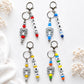 Personalised colourful silicone name charm for nappy bags, backpacks and keys
