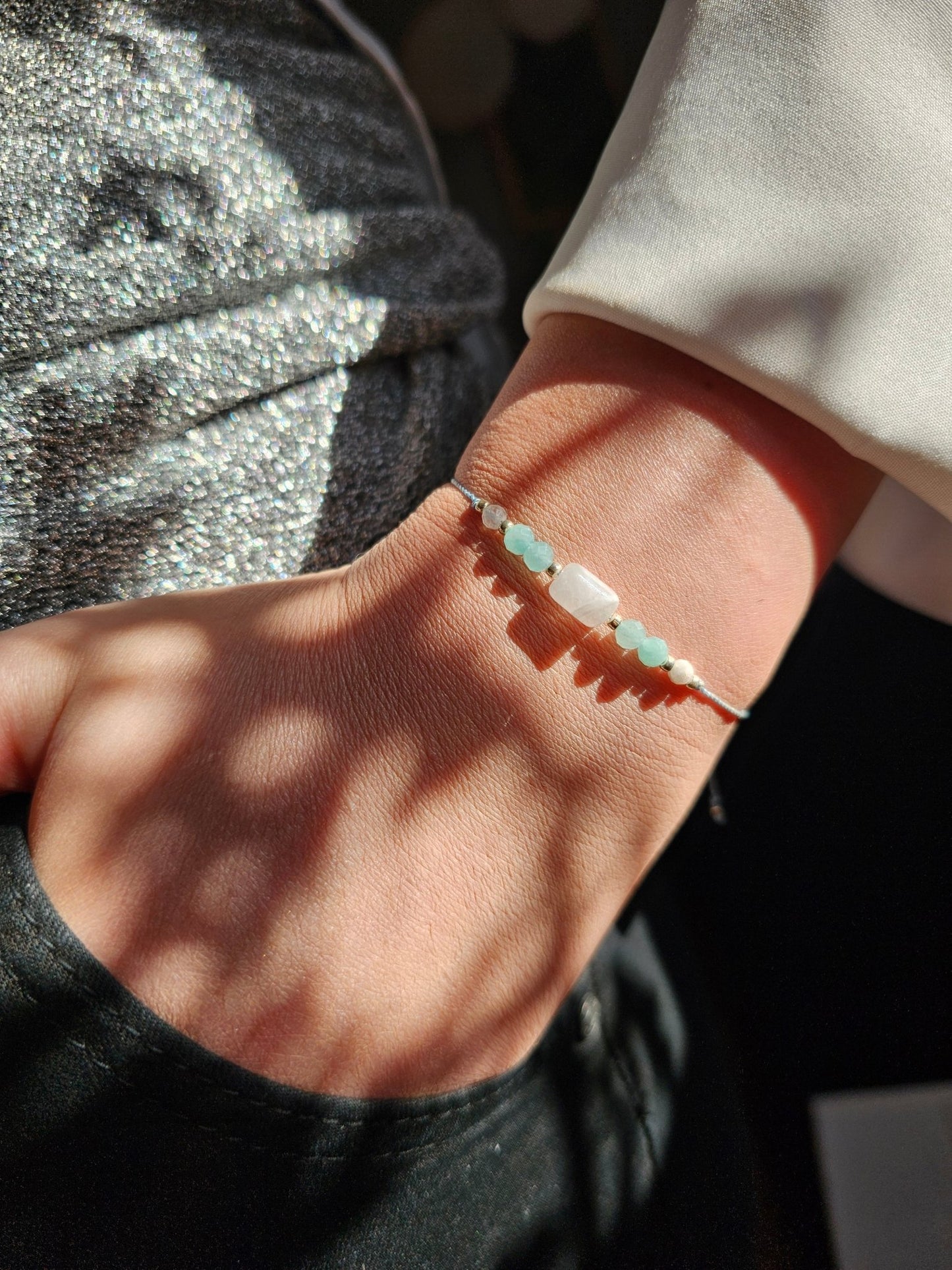 Handmade Friends Forever bracelet with Moonstone and Amazonite – a meaningful crystal gift for best friend. Features sterling silver adjustable clasp, soft durable cord, and elegant gift pouch. Symbol of trust, love, harmony and emotional connection.
