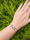 Handmade Labradorite and Lapis Lazuli bracelet with sterling silver beads on adjustable cord, combining elegance with positive energy and protection.