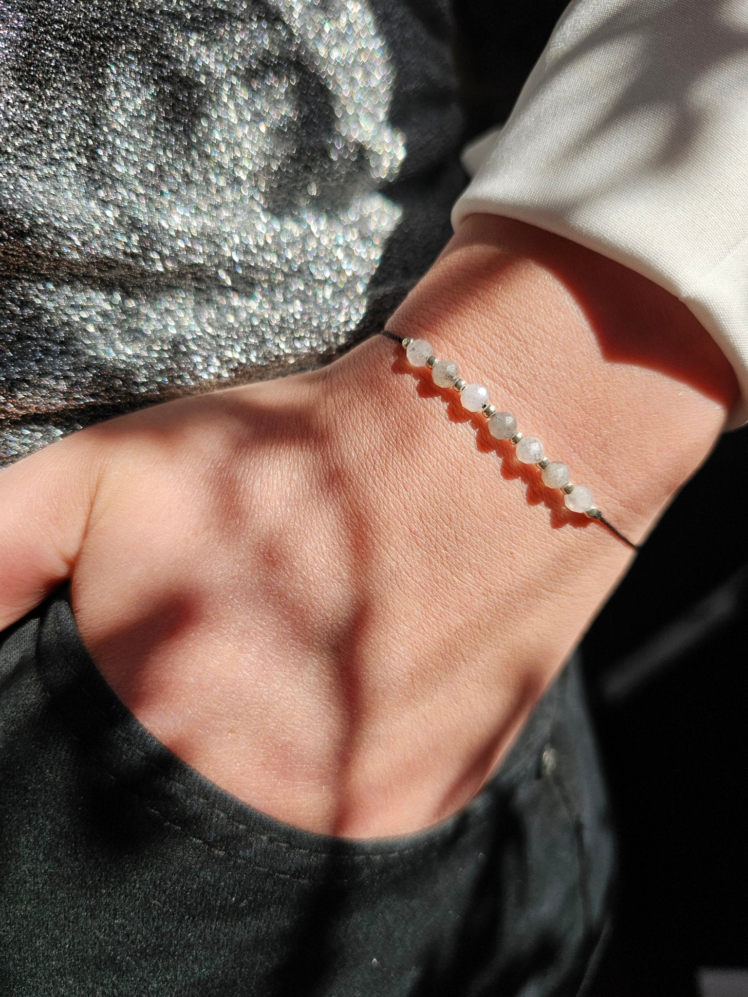 Handmade Labradorite and Moonstone bracelet with sterling silver beads and adjustable cord. Natural stones for protection, intuition, and emotional balance.