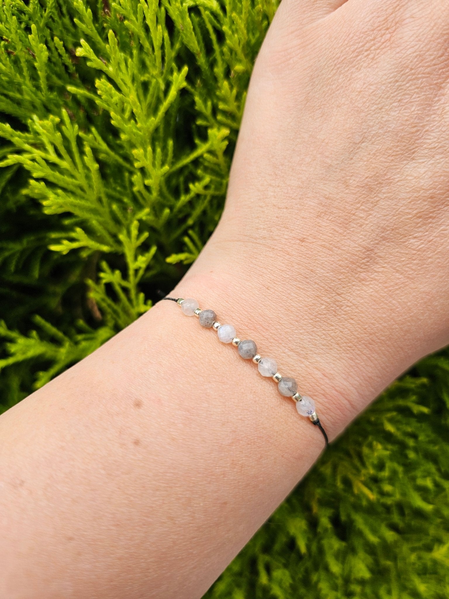 Handmade Labradorite and Moonstone bracelet with sterling silver beads and adjustable cord. Natural stones for protection, intuition, and emotional balance.