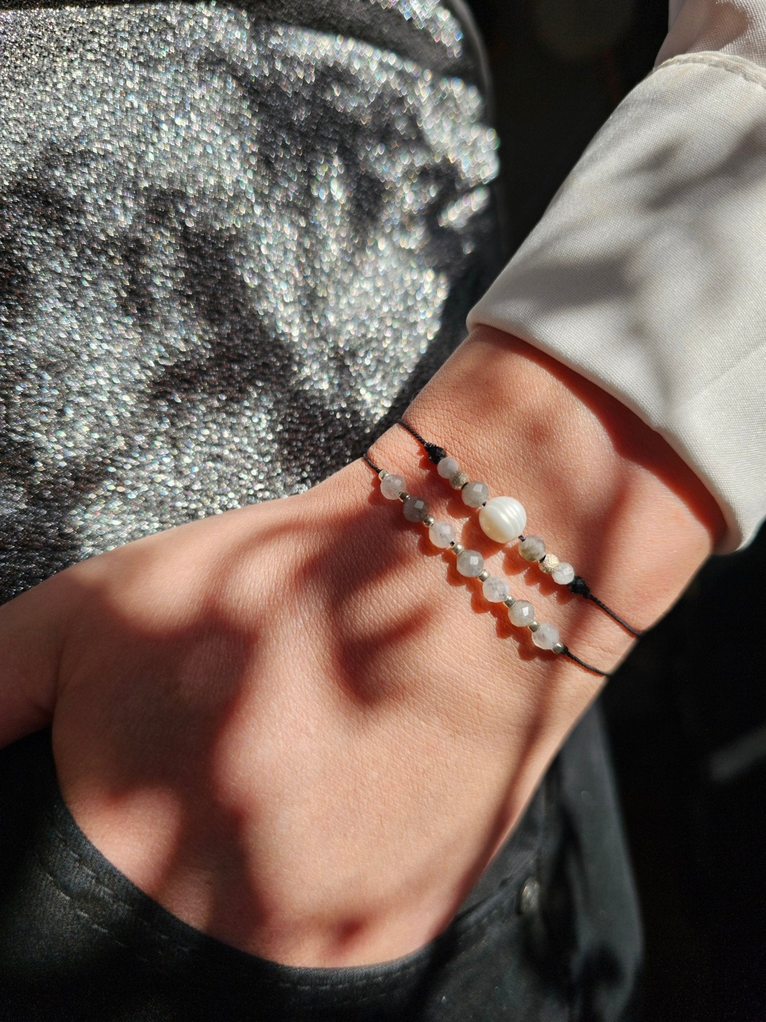Handmade Labradorite and Moonstone bracelet with sterling silver beads and adjustable cord. Natural stones for protection, intuition, and emotional balance.