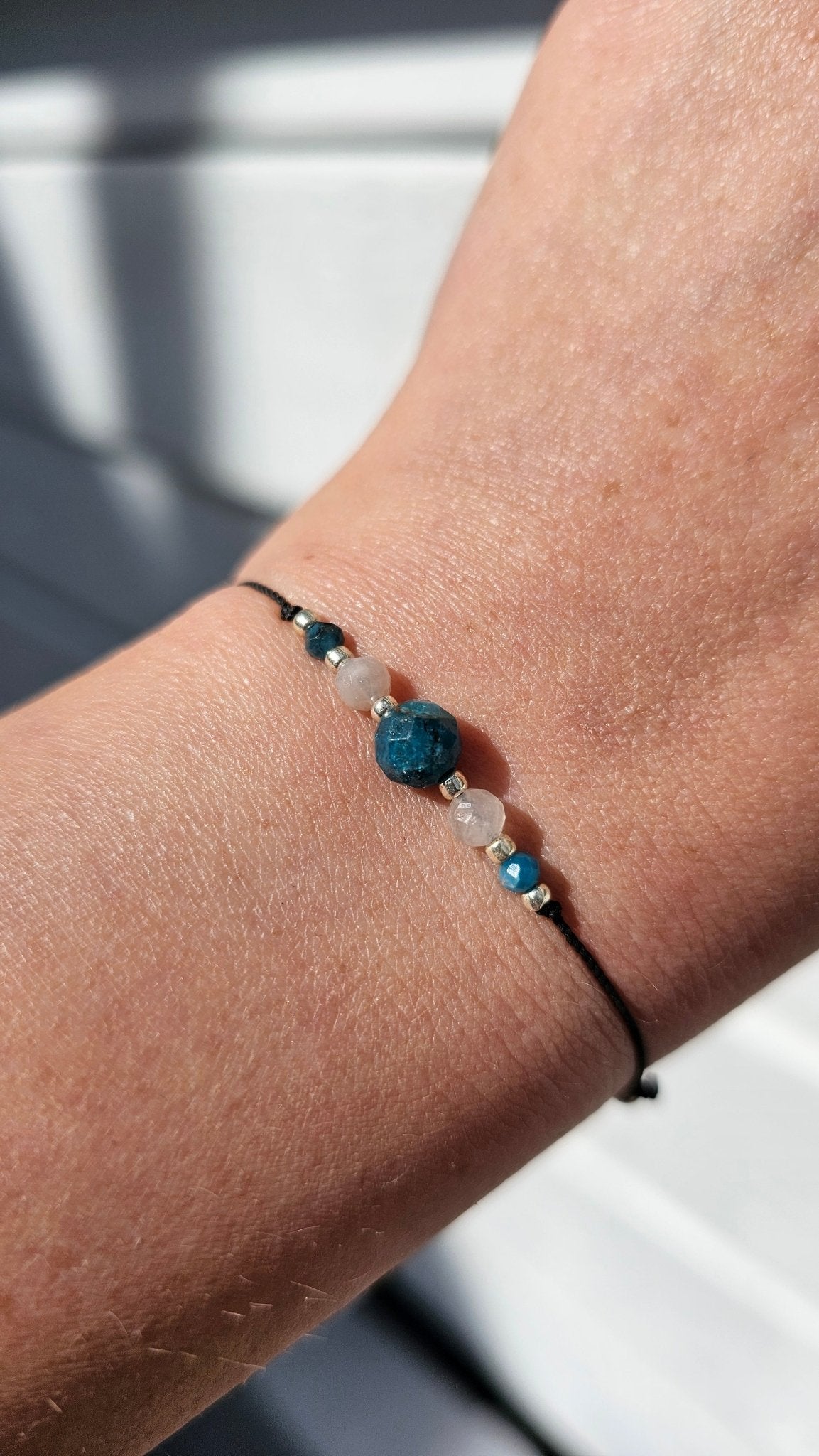 Handmade lucky bracelet with Apatite and Moonstone for healing and protection
Emotional healing bracelet with red string and natural gemstones
Adjustable lucky bracelet for balance and spiritual clarity
Close-up of Apatite and Moonstone charm bracelet – handmade in Ireland
Gift-wrapped energy bracelet for intuition, peace and inner growth
