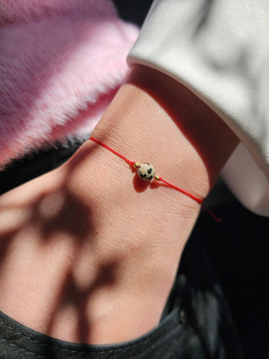 Lucky Jasper Dalmatian bracelet with red string – handmade good luck jewellery UK
Natural Jasper Dalmatian stone bracelet for protection and emotional healing
Adjustable lucky bracelet with sterling silver stoppers and TOHO beads
Handmade good luck bracelet with black cord and natural Jasper Dalmatian stones
Spiritual growth and protection Jasper Dalmatian bracelet – gift ready packaging
