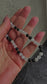 rotective crystal charm with black onyx & moonstone. Calming, fidget-friendly and perfect for your phone, keys, or bag. Handmade with meaning.
