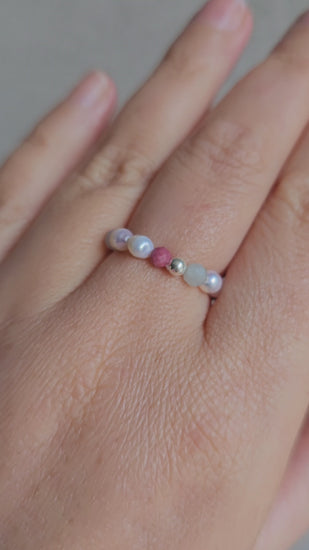 Aurora Ring – handmade Irish elastic ring with 3mm rhodonite, aquamarine & 3–4mm pearls, sterling silver bead. Healing crystal jewellery for calm, compassion & inner peace. Velvet pouch included.