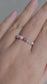 Aurora Ring – handmade Irish elastic ring with 3mm rhodonite, aquamarine & 3–4mm pearls, sterling silver bead. Healing crystal jewellery for calm, compassion & inner peace. Velvet pouch included.