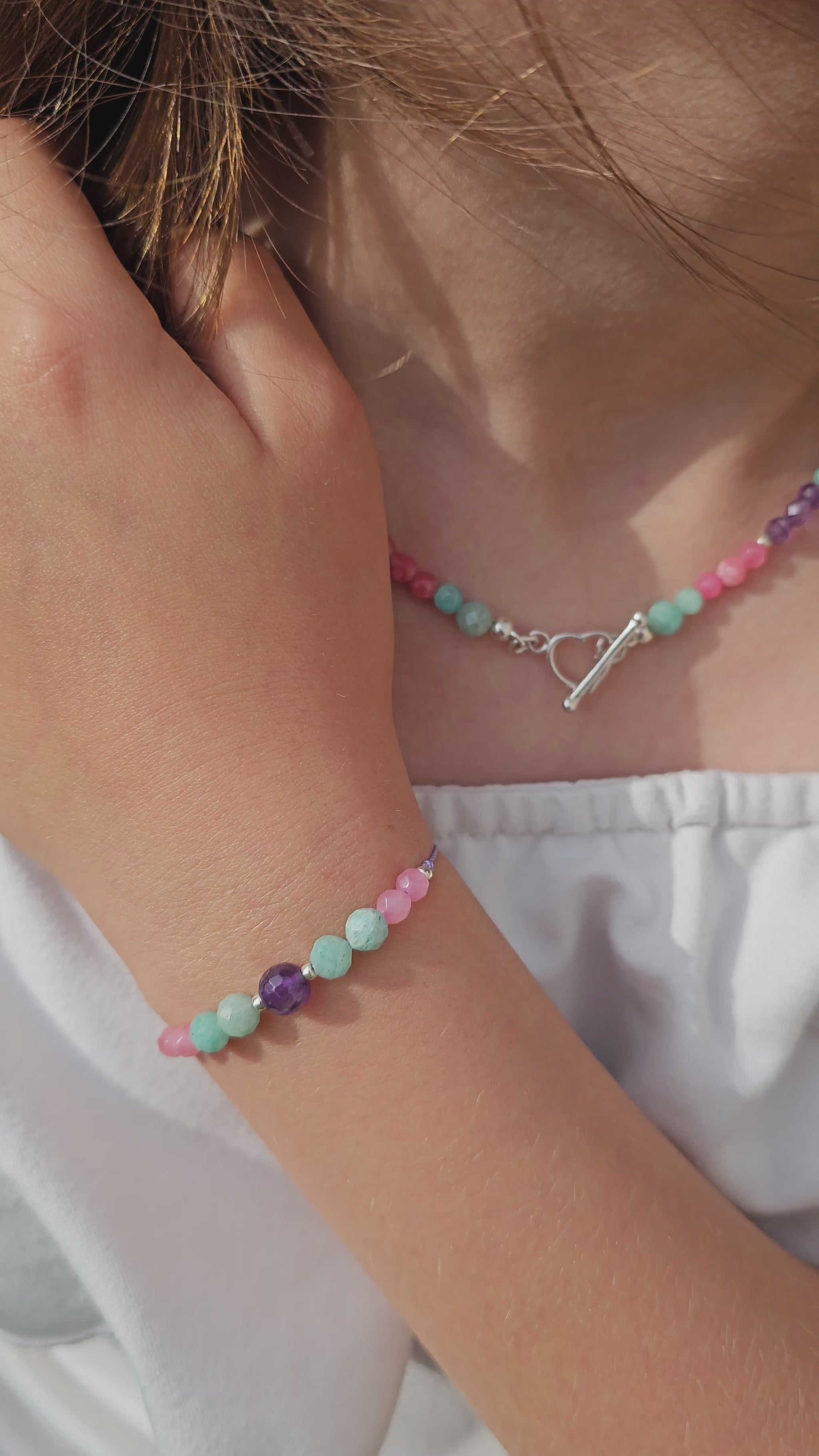 Handmade choker necklace with amazonite, amethyst and pink chalcedony beads, sterling silver heart clasp – custom size, Irish jewellery
Close-up of gemstone choker – amazonite, amethyst, pink chalcedony, sterling silver clasp
Elegant handmade gemstone choker with sterling silver heart toggle clasp – personalised length option