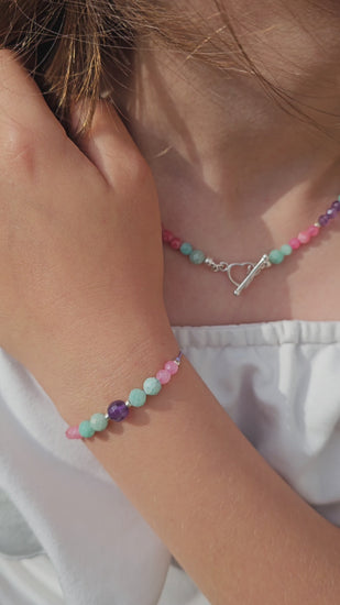 Handmade choker necklace with amazonite, amethyst and pink chalcedony beads, sterling silver heart clasp – custom size, Irish jewellery
Close-up of gemstone choker – amazonite, amethyst, pink chalcedony, sterling silver clasp
Elegant handmade gemstone choker with sterling silver heart toggle clasp – personalised length option